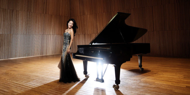 Joyce Yang 5_KT Kim Joyce Yang standing next to piano on stage