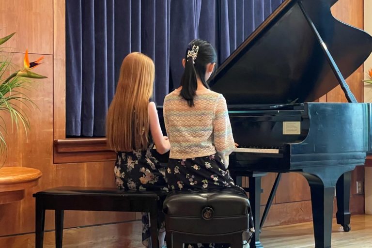 Two studens at piano