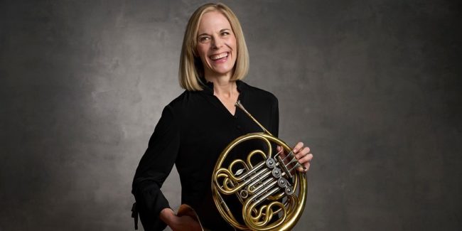 Liz Freimuth 1080 woman in black shirt, holding french horn.
