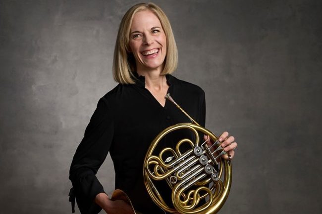 Liz Freimuth 1080 woman in black shirt, holding french horn.