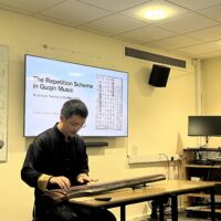 PhD candidate Ruixue Hu giving a lecture-recital at Oxford University