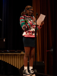 An East High School student introduces the piece