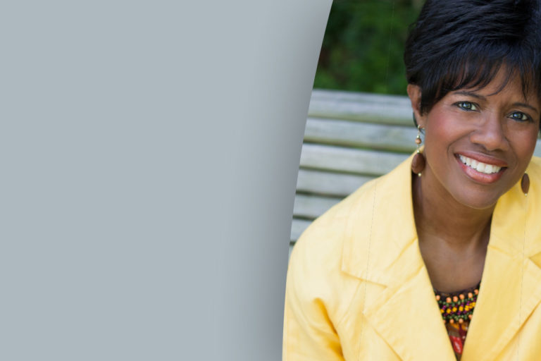 Headshot of Dr. Rosephanye Powell in a yellow suit.