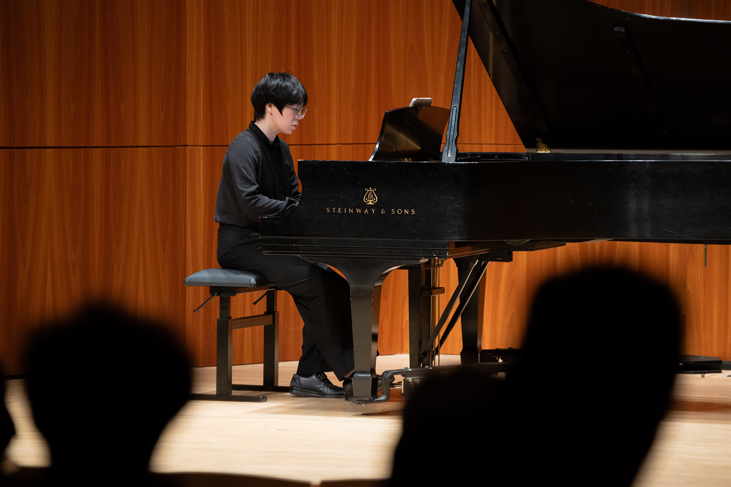 Student at piano in Hatch Hall Student at piano in Hatch Hall image