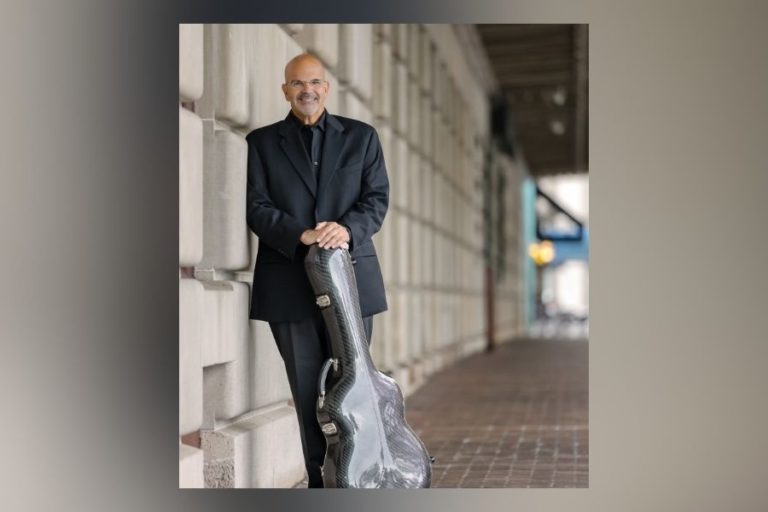 Nick Glouses in front of Eastman School of Music