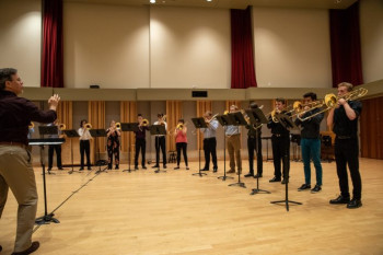 Mark Kellogg leads an ESTI Trombone Choir rehearsal