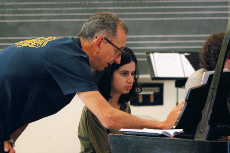 Dariusz Terefenko, Associate Professor of Jazz and Contemporary Media at Eastman, working with a Summer at Eastman piano student.