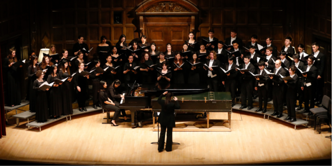 treble-chorus A choir of 50 singers in concert dress standing on risers in Kilbourn Hall